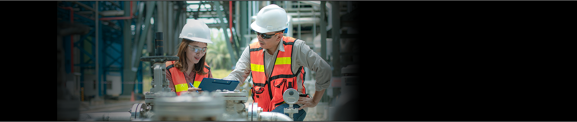 Workers in hard hats and reflective vest